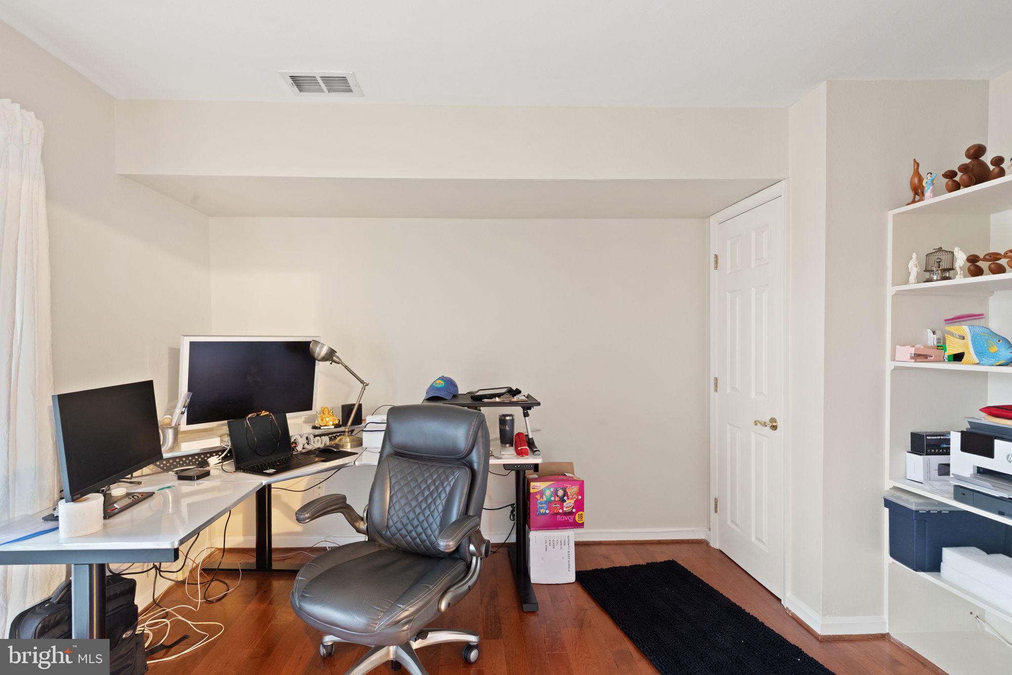 608 Churchill Road, Unit 608E Bel Air, MD 21014 - Photo 9 of 25 a view of a workspace with furniture and wooden floor