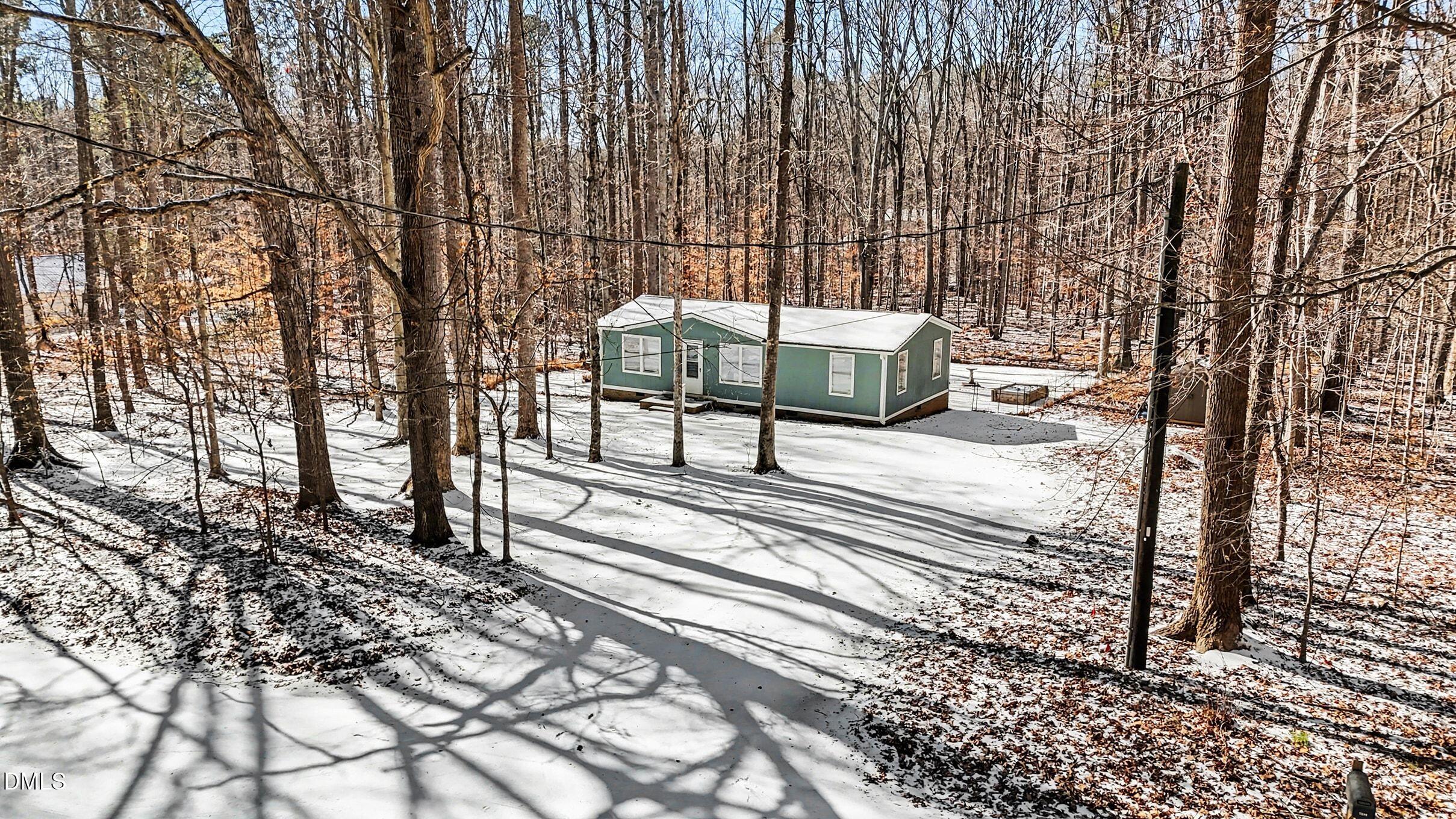 7223 Apple Mill Road Efland, NC 27243 - Photo 29 of 31 a roof deck with a table and chairs next to a yard