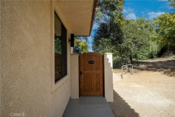 a view of a house with backyard space and balcony