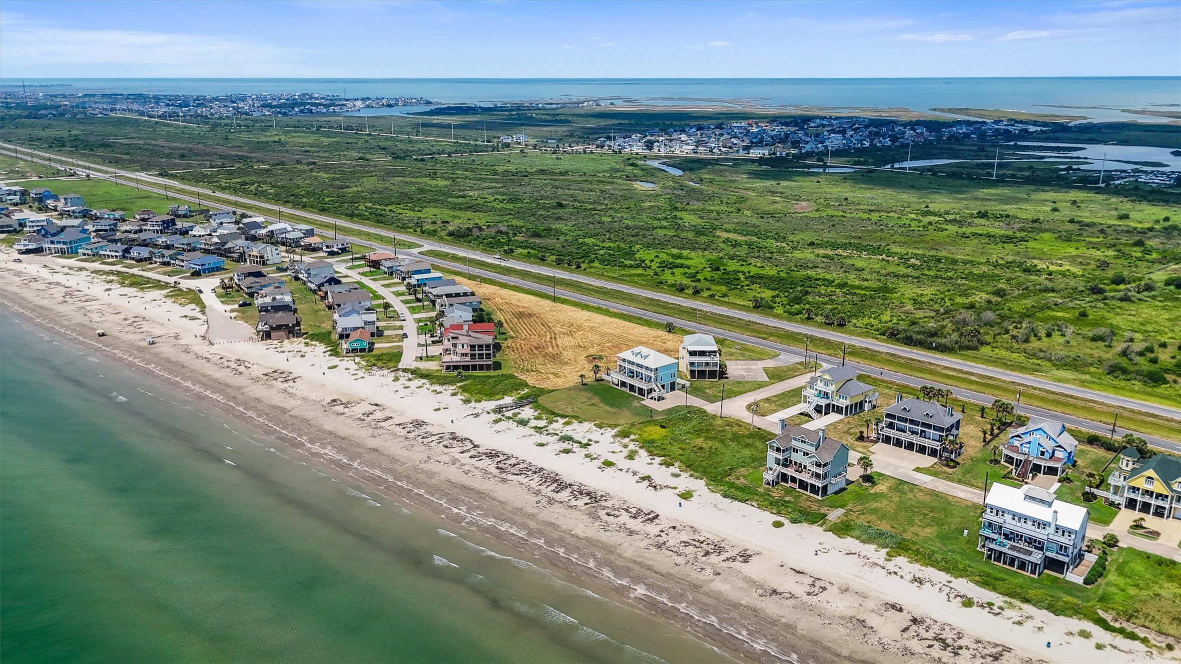 a view of a large body of water with a building in the back