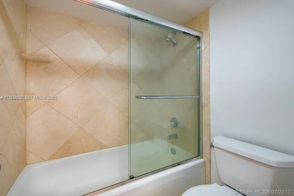 a bathroom with a bathtub and shower