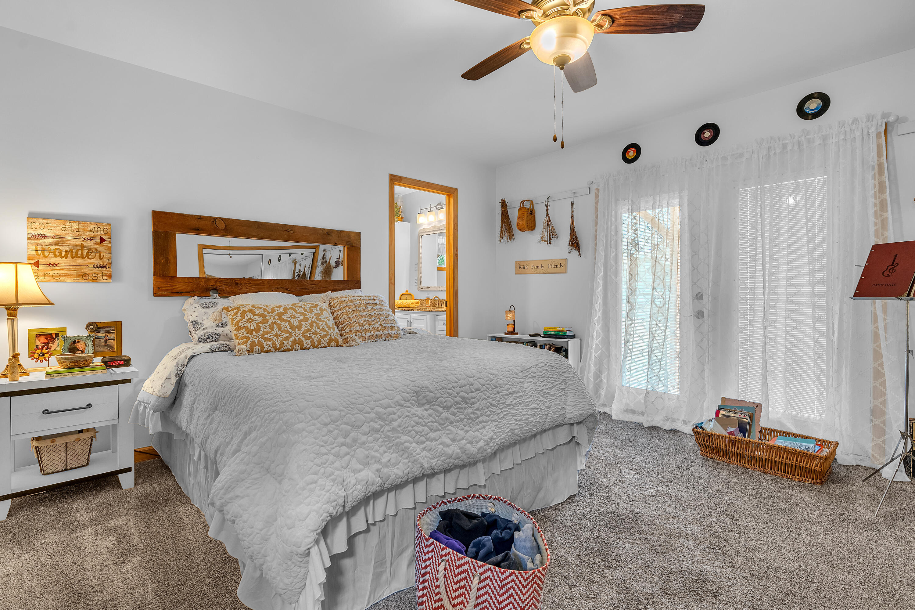 9960 Wildwood Place Demotte, IN 46310 - Photo 17 of 36 a bedroom with a bed and a chandelier