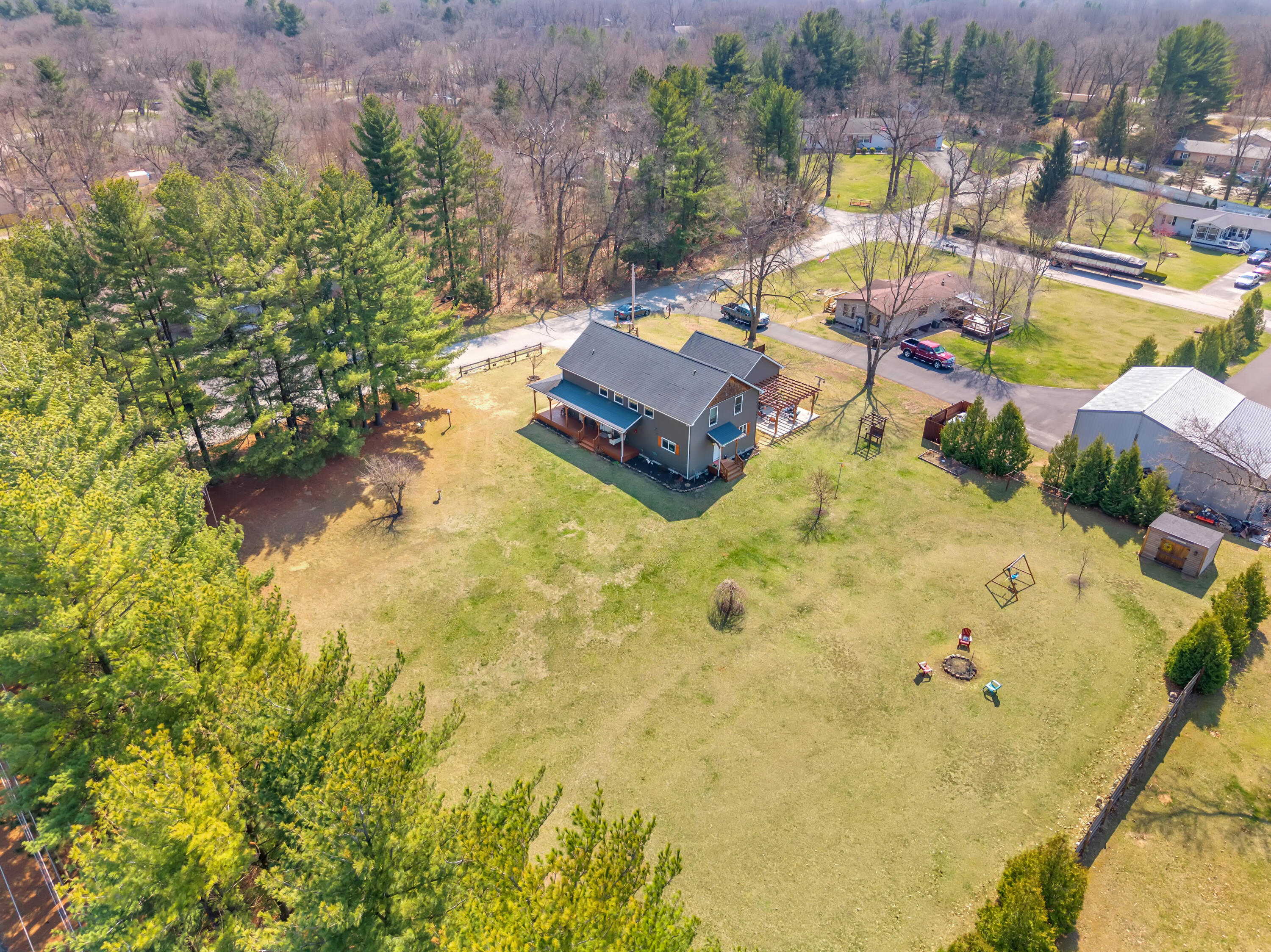 9960 Wildwood Place Demotte, IN 46310 - Photo 27 of 36 a swimming pool with outdoor seating and yard