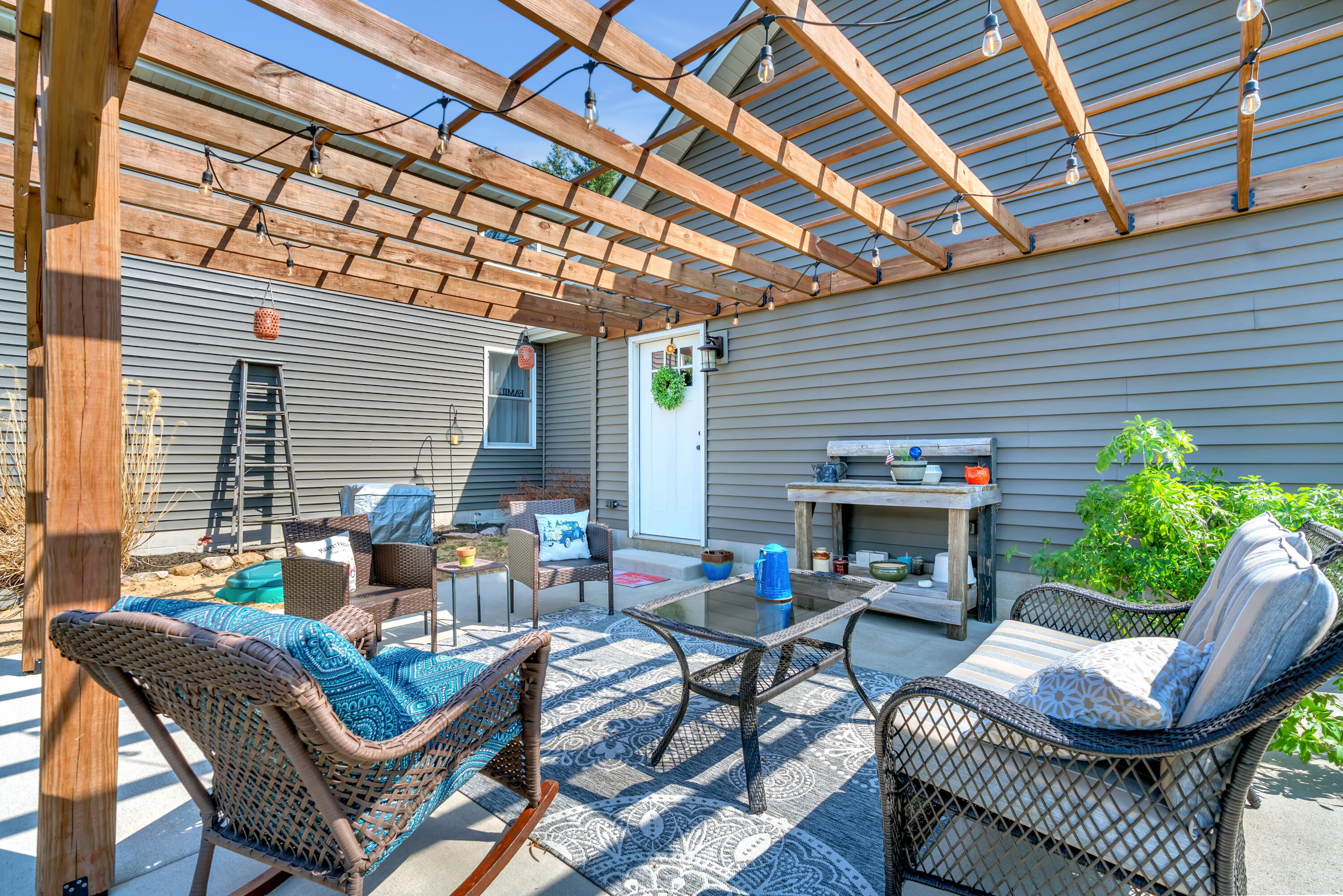 9960 Wildwood Place Demotte, IN 46310 - Photo 36 of 36 a outdoor living space with furniture and a ceiling fan