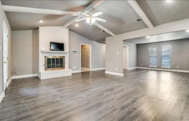a view of a livingroom with wooden floor
