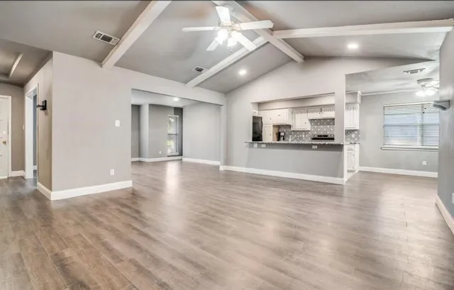 a view of a kitchen with a sink and a stove top oven