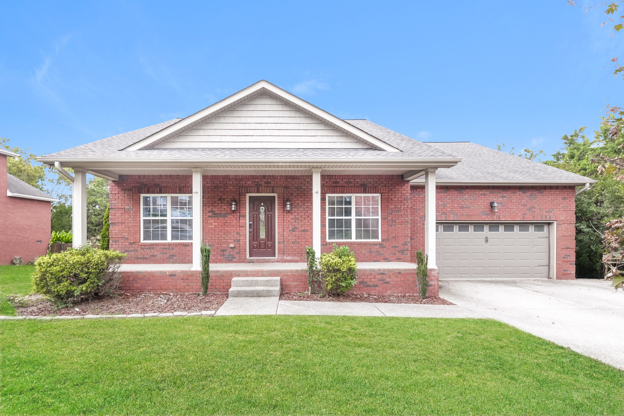 106 Abbey Road Lebanon, TN 37090 - Photo 1 of 17 a front view of a house with a yard and porch