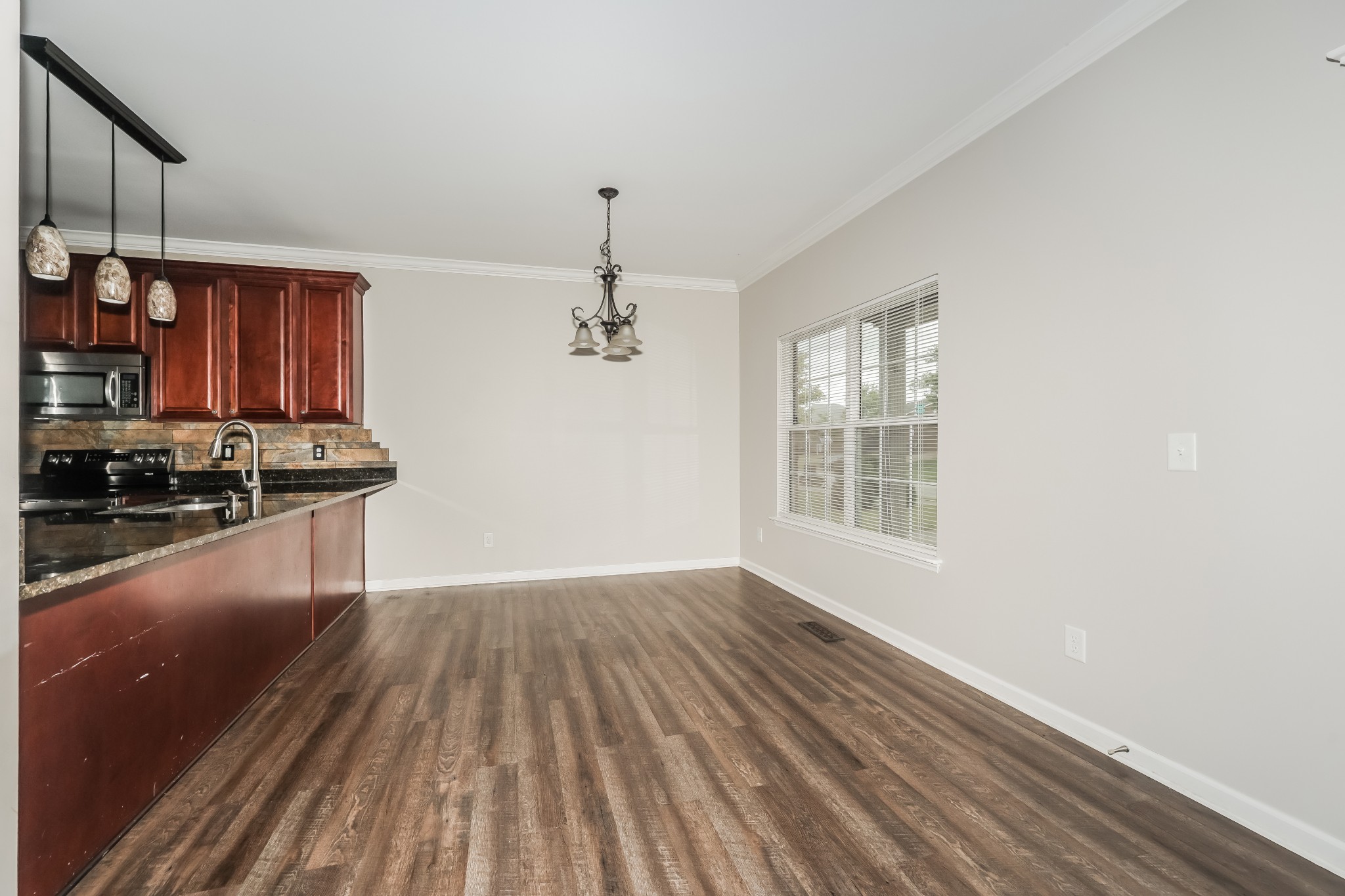 106 Abbey Road Lebanon, TN 37090 - Photo 4 of 17 a view of wooden floor and a stove in a room