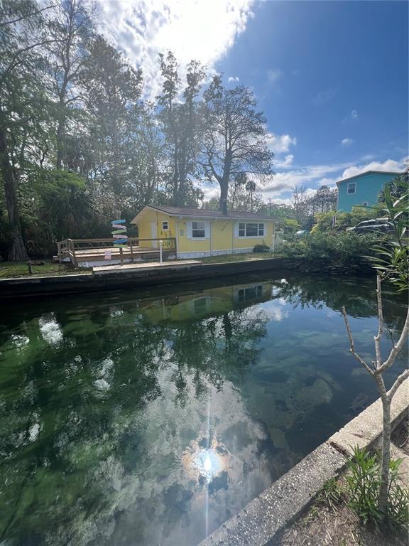 7222 Tropical Drive Weeki Wachee, FL 34607 - Photo 9 of 23 a view of a lake from a yard