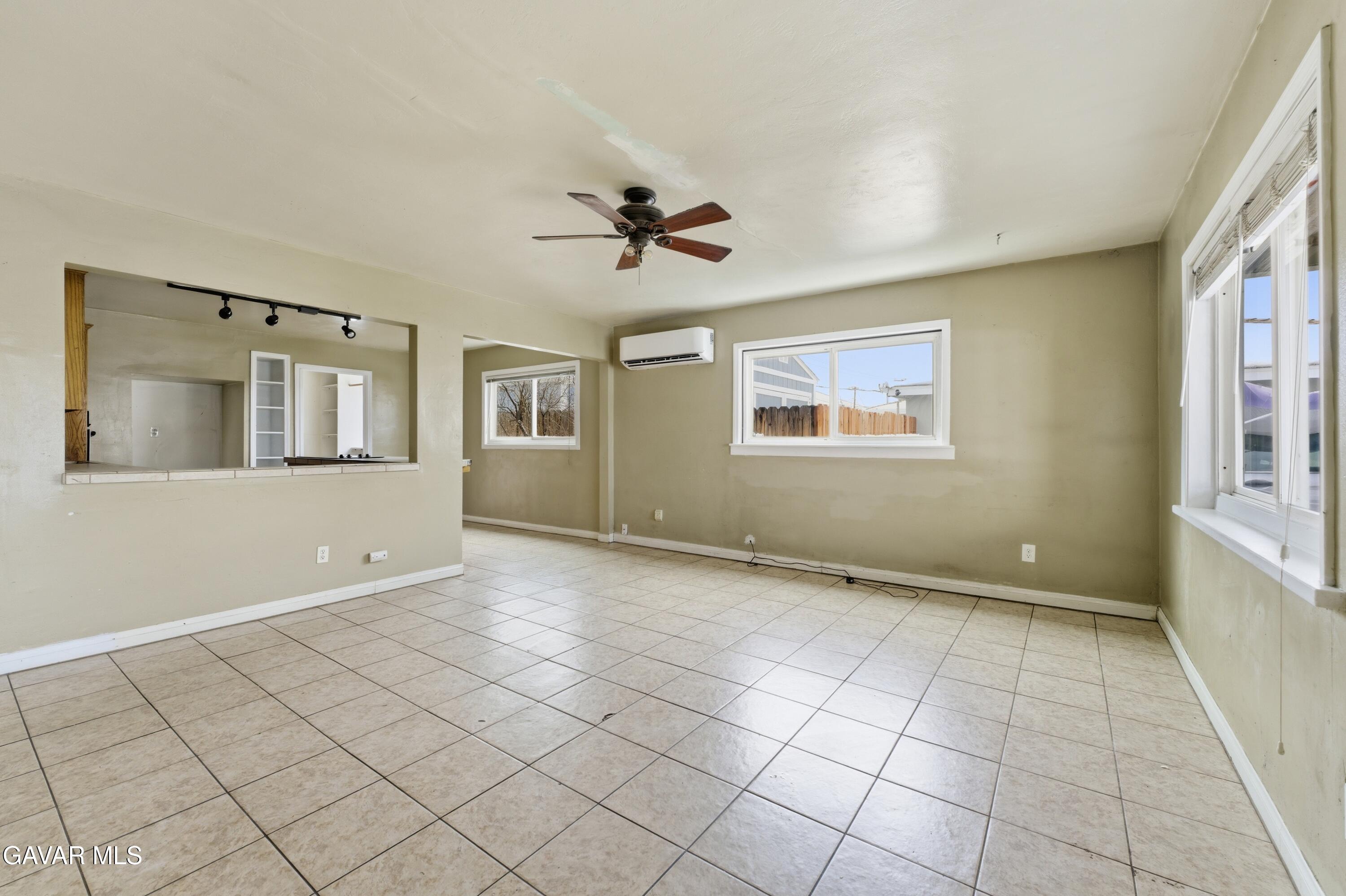 914 Acacia Court Tehachapi, CA 93561 - Photo 4 of 18 a view of an empty room with a window