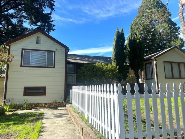a front view of house yard with green space