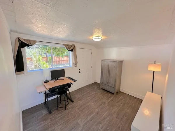 a workspace with furniture and a window