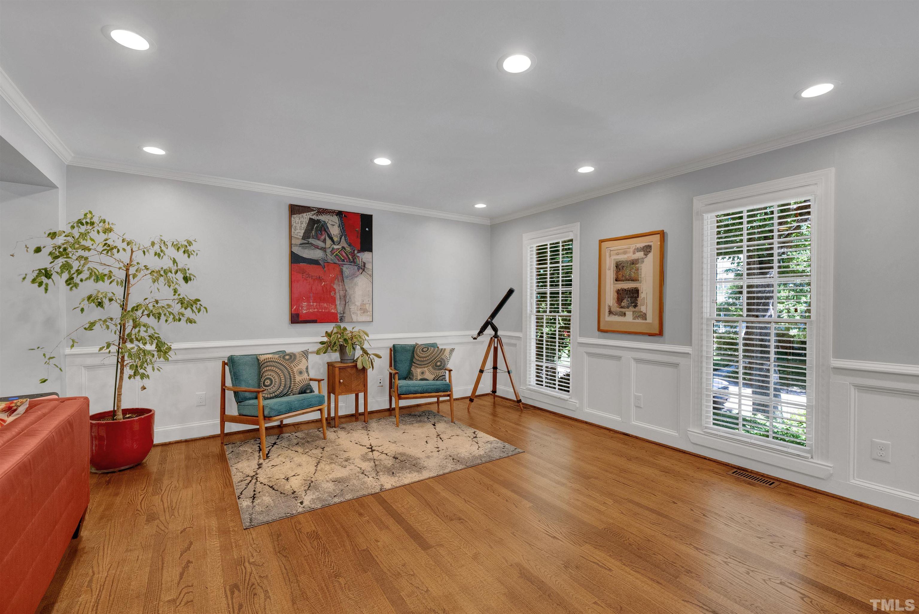 8209 Blue Heron Way Raleigh, NC 27615 - Photo 11 of 31 a living room with furniture and a wooden floor