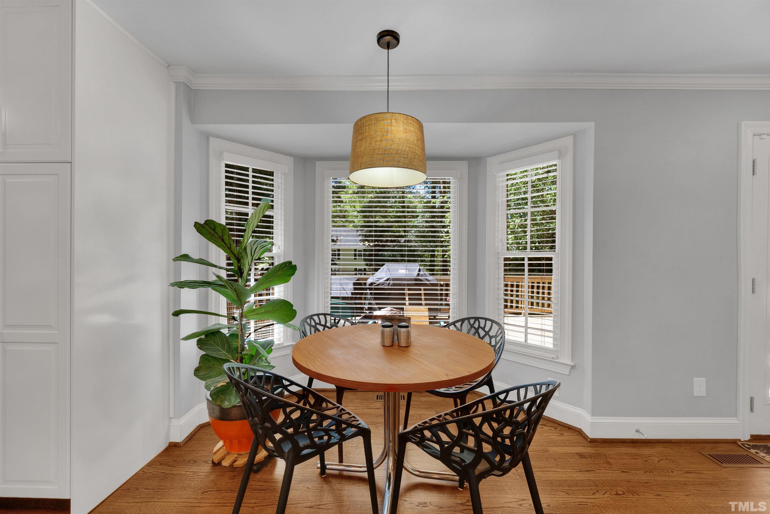 8209 Blue Heron Way Raleigh, NC 27615 - Photo 12 of 31 a dining room with furniture and window