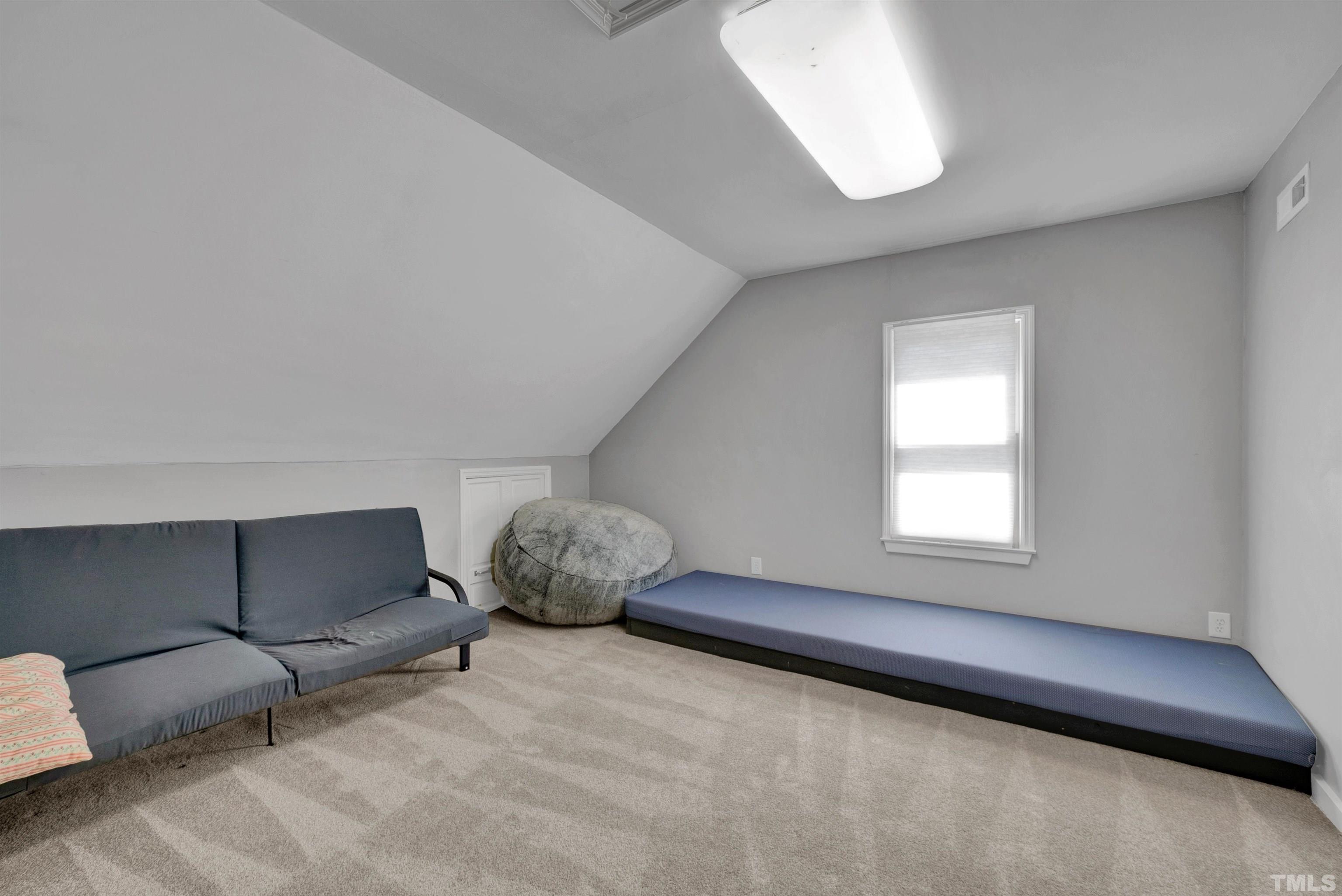 8209 Blue Heron Way Raleigh, NC 27615 - Photo 27 of 31 a living room with furniture and a window