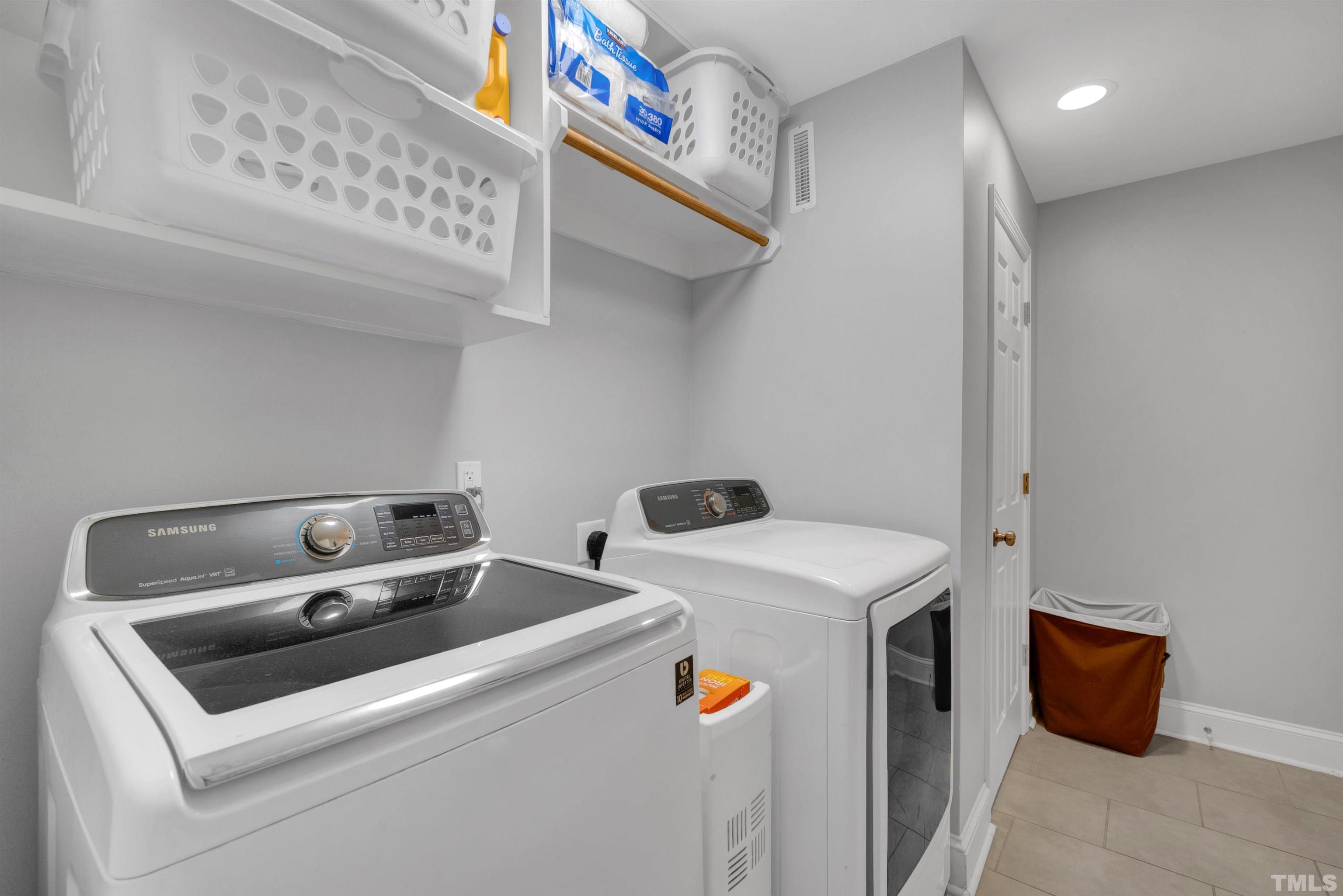 8209 Blue Heron Way Raleigh, NC 27615 - Photo 28 of 31 a utility room with dryer and washer