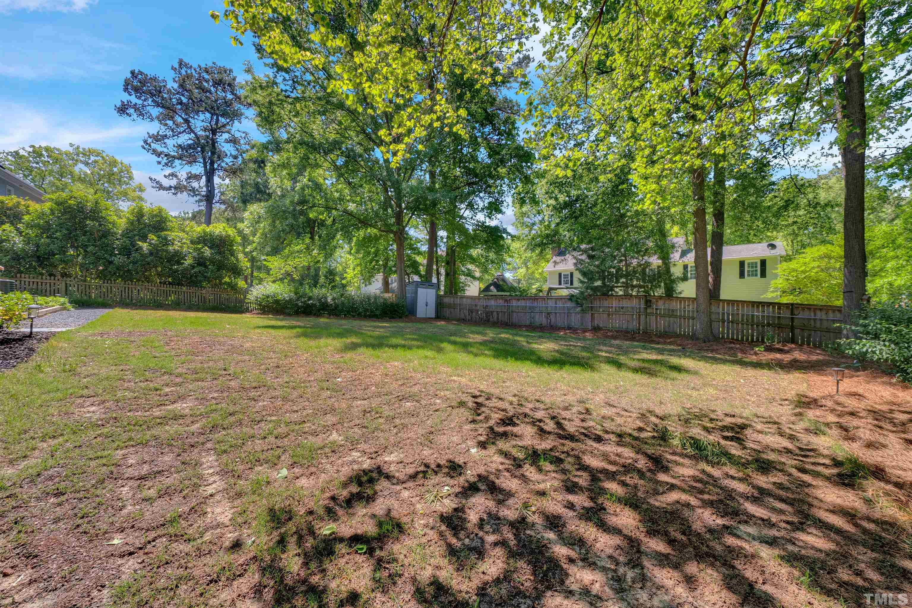 8209 Blue Heron Way Raleigh, NC 27615 - Photo 4 of 31 a view of a yard with a large tree