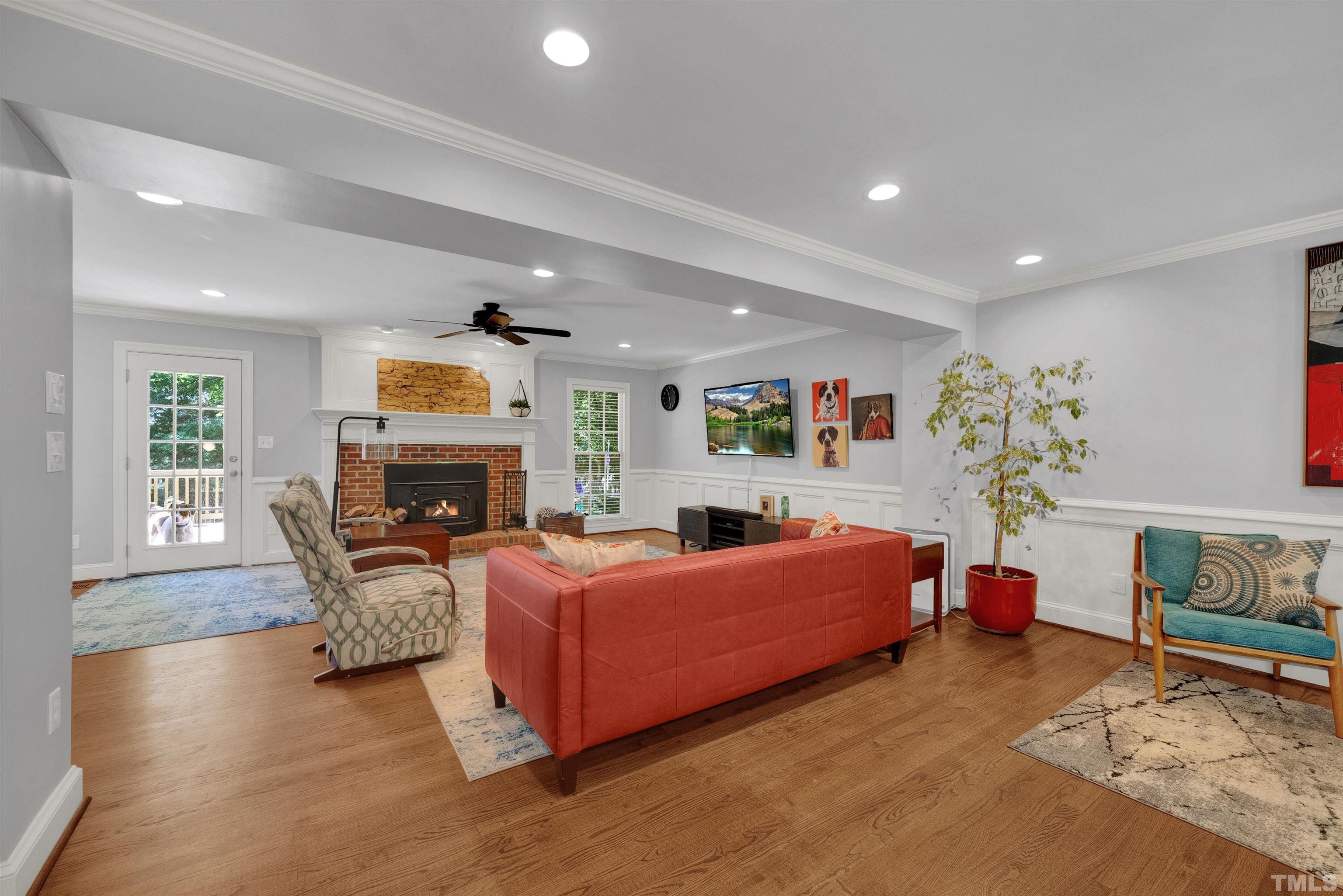 8209 Blue Heron Way Raleigh, NC 27615 - Photo 8 of 31 a bedroom with furniture and a fireplace