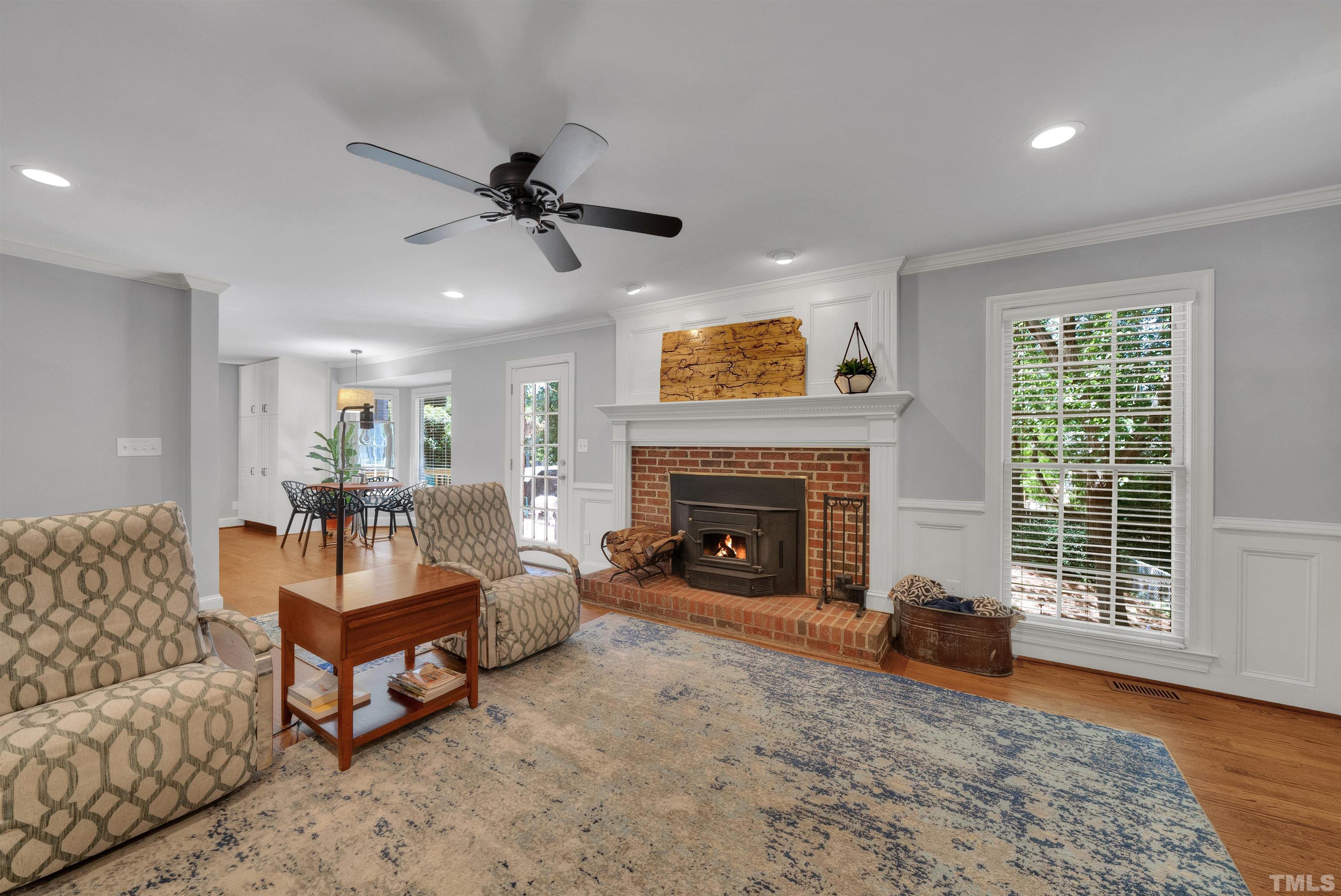 8209 Blue Heron Way Raleigh, NC 27615 - Photo 10 of 31 a living room with furniture and a fireplace