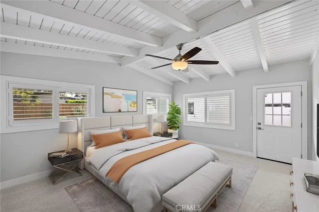 a bedroom with a large bed and a window