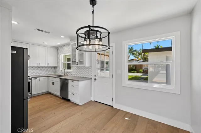 a kitchen with stainless steel appliances granite countertop a stove and a refrigerator