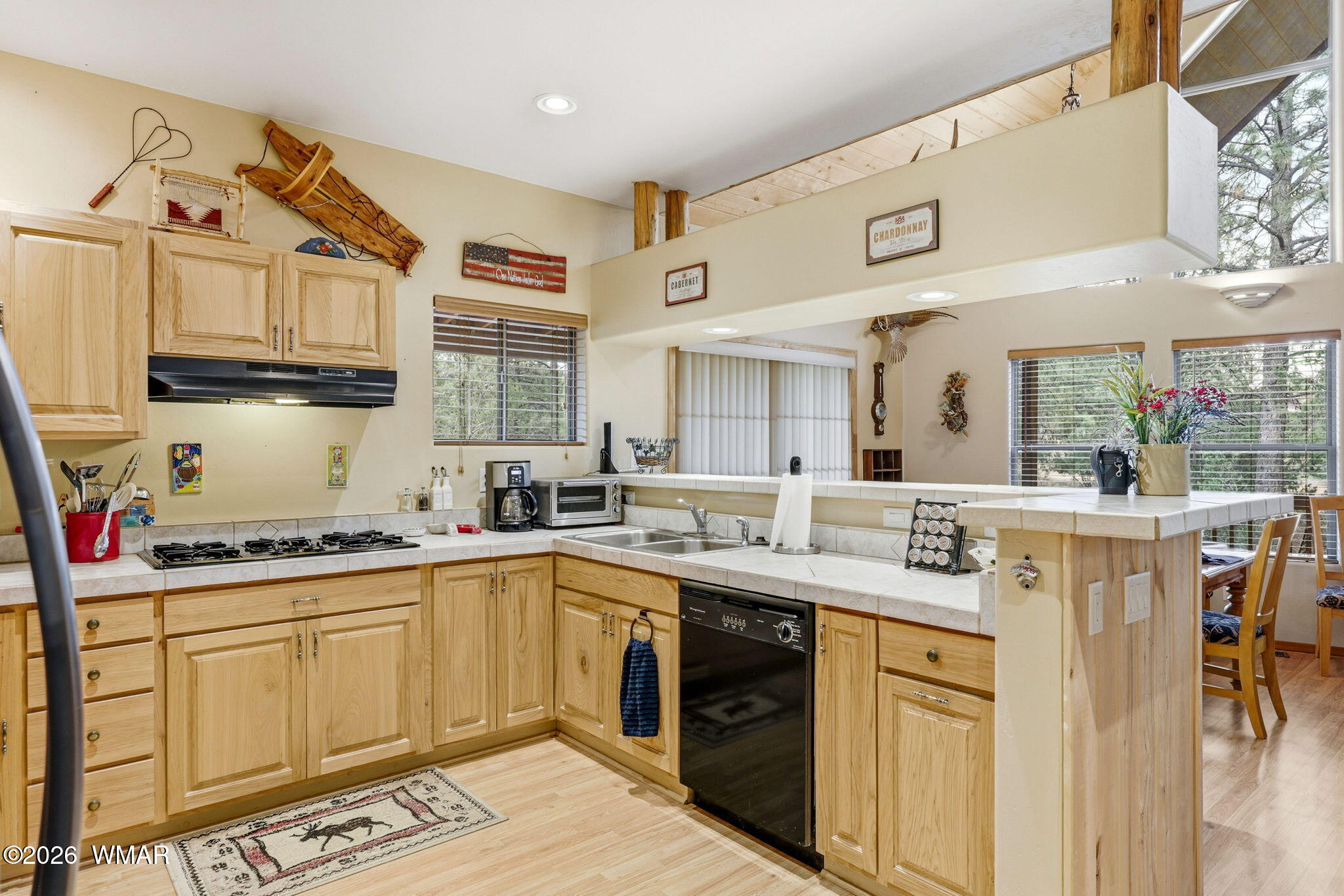 2008 Lexington Overgaard, AZ 85933 - Photo 11 of 34 a kitchen with a sink window and cabinets