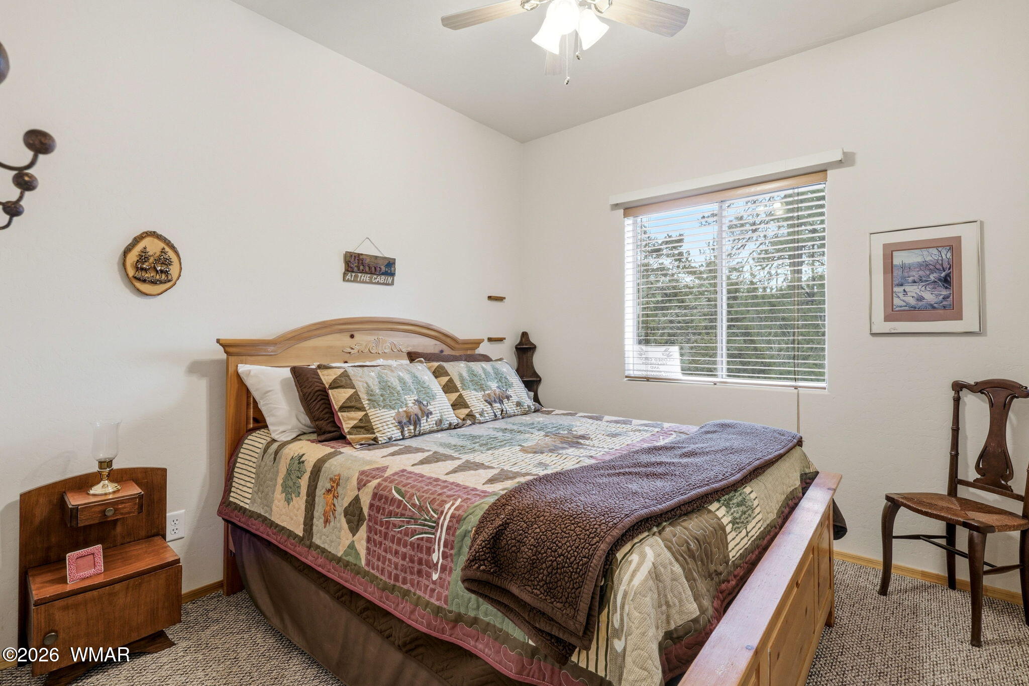 2008 Lexington Overgaard, AZ 85933 - Photo 16 of 34 a bedroom with a bed and a chandelier