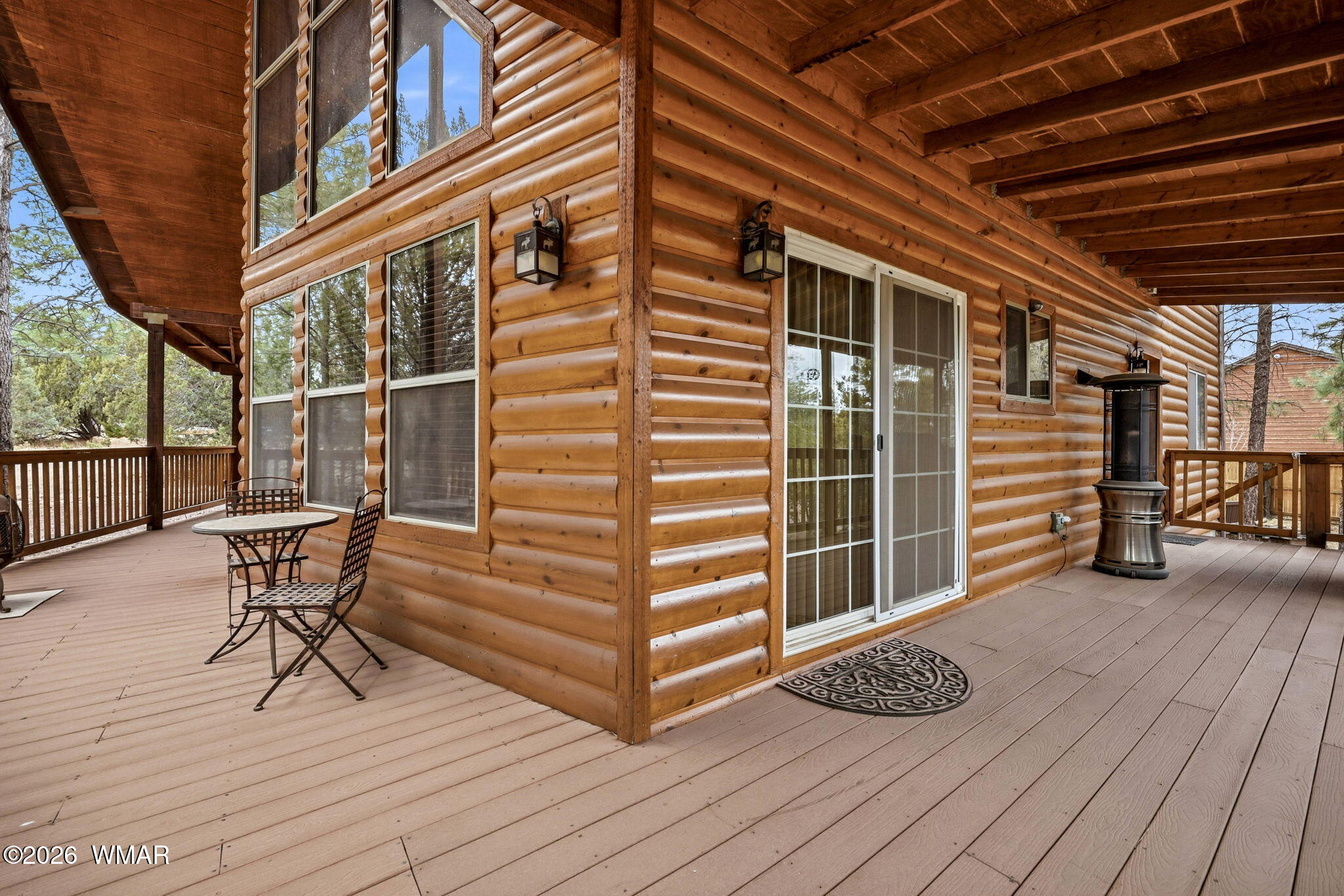 2008 Lexington Overgaard, AZ 85933 - Photo 2 of 34 a view of a roof deck with table and chairs with wooden floor and fence