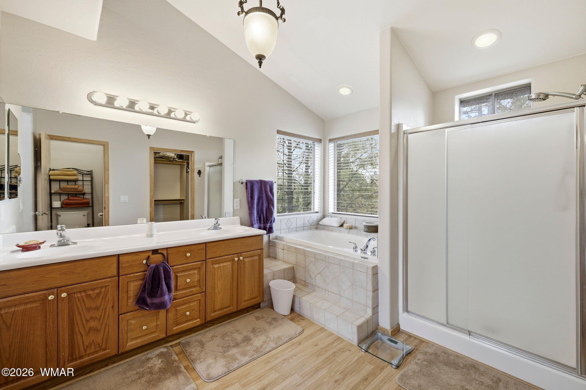 2008 Lexington Overgaard, AZ 85933 - Photo 24 of 34 a large bathroom with a double vanity sink a mirror and a bathtub