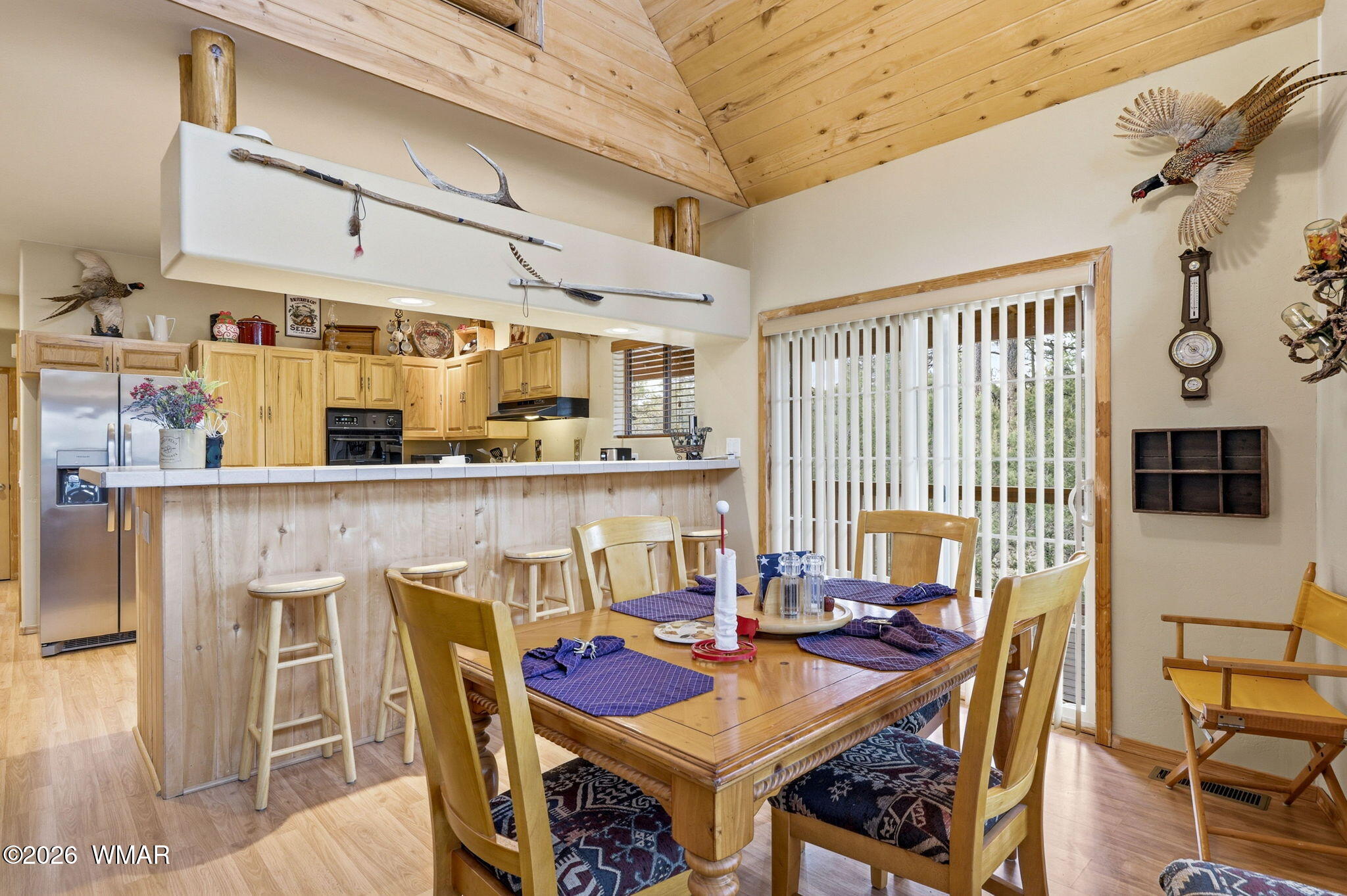 2008 Lexington Overgaard, AZ 85933 - Photo 10 of 34 a view of a dining room with furniture window and wooden floor