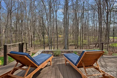 a view of a roof deck with sitting area