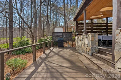 a view of a pathway of a house with a backyard