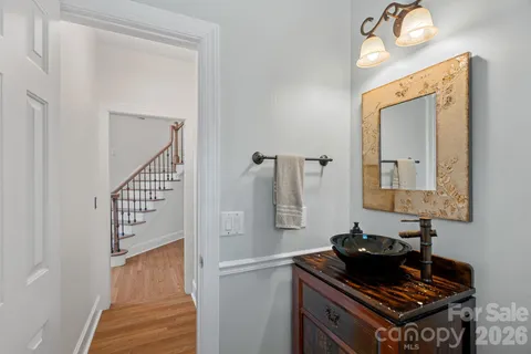 a bathroom with a mirror and a sink