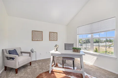 a workspace with furniture and a window