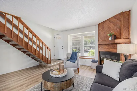 a living room with furniture and a table