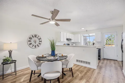 a view of a dining room with furniture window and wooden floor