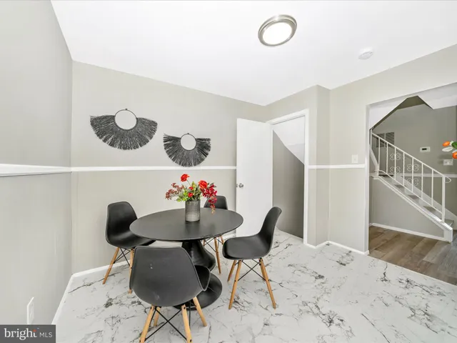 a kitchen with a stove refrigerator and cabinets
