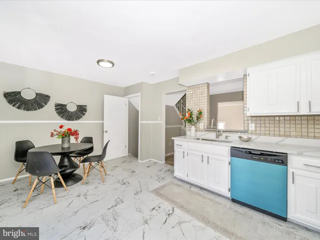 a bedroom with a bed and a large mirror