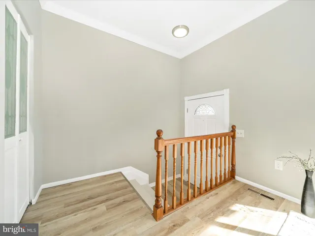 a view of a hallway view with staircase