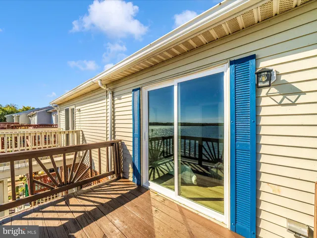 a view of a porch with wooden floor and outdoor space