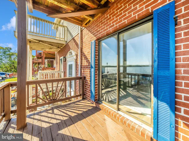 a view of a house with pool and ocean view