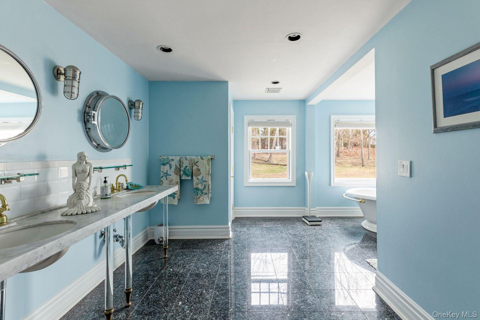 33 Beach Road Northport, NY 11768 - Photo 22 of 50 a bathroom with a granite countertop sink and a mirror