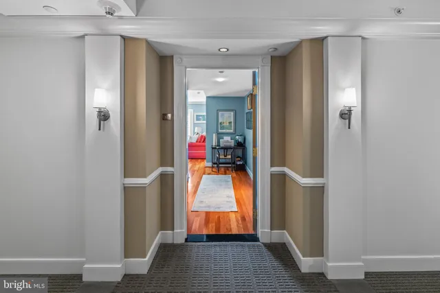 a view of a swimming pool with lounge chairs in patio