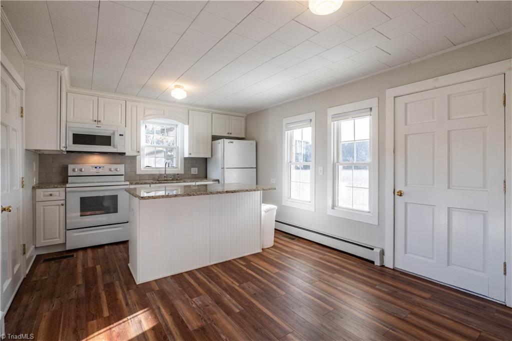 663 Ruritan Road Roaring River, NC 28669 - Photo 17 of 43 Kitchen has been remodeled and features LVP flooring.
