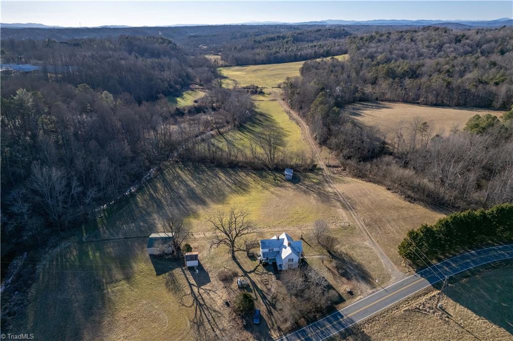 663 Ruritan Road Roaring River, NC 28669 - Photo 2 of 43 Ideal mini farm with stream, pastureland, run-in shed and barn.