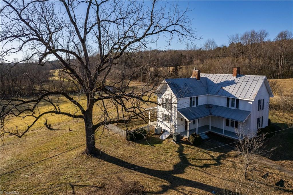 663 Ruritan Road Roaring River, NC 28669 - Photo 3 of 43 Home features metal roof, replacement windows and vinyl siding.