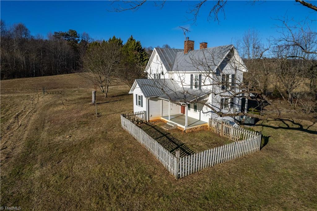 663 Ruritan Road Roaring River, NC 28669 - Photo 5 of 43 Property features picket fenced area for pets.