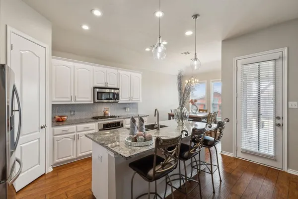 a dining room with furniture and window
