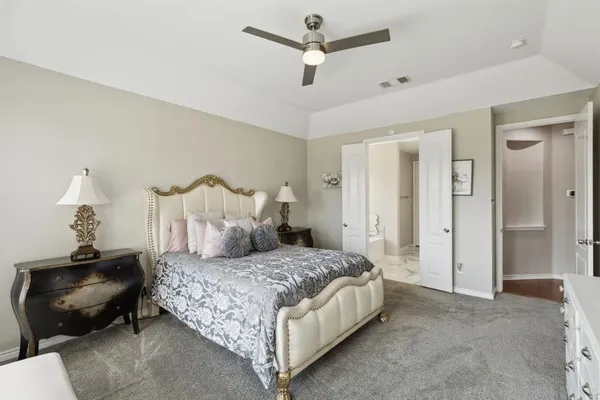 a bedroom with bed and window