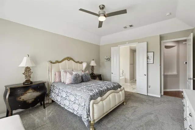 a bedroom with bed and window